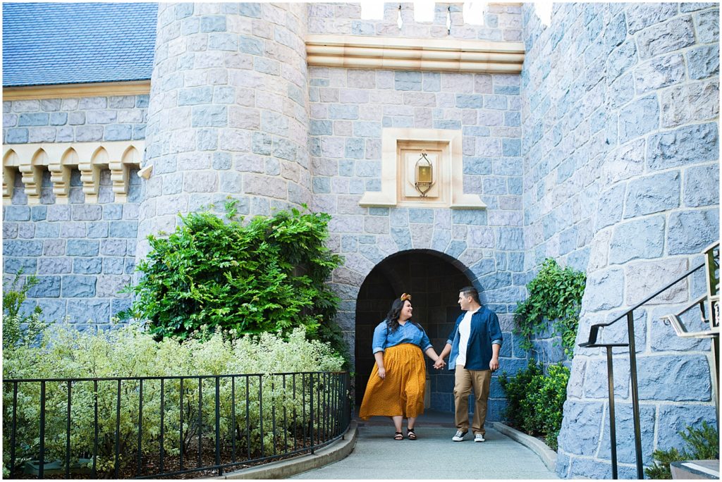 Disneyland couple's portraits at the castle