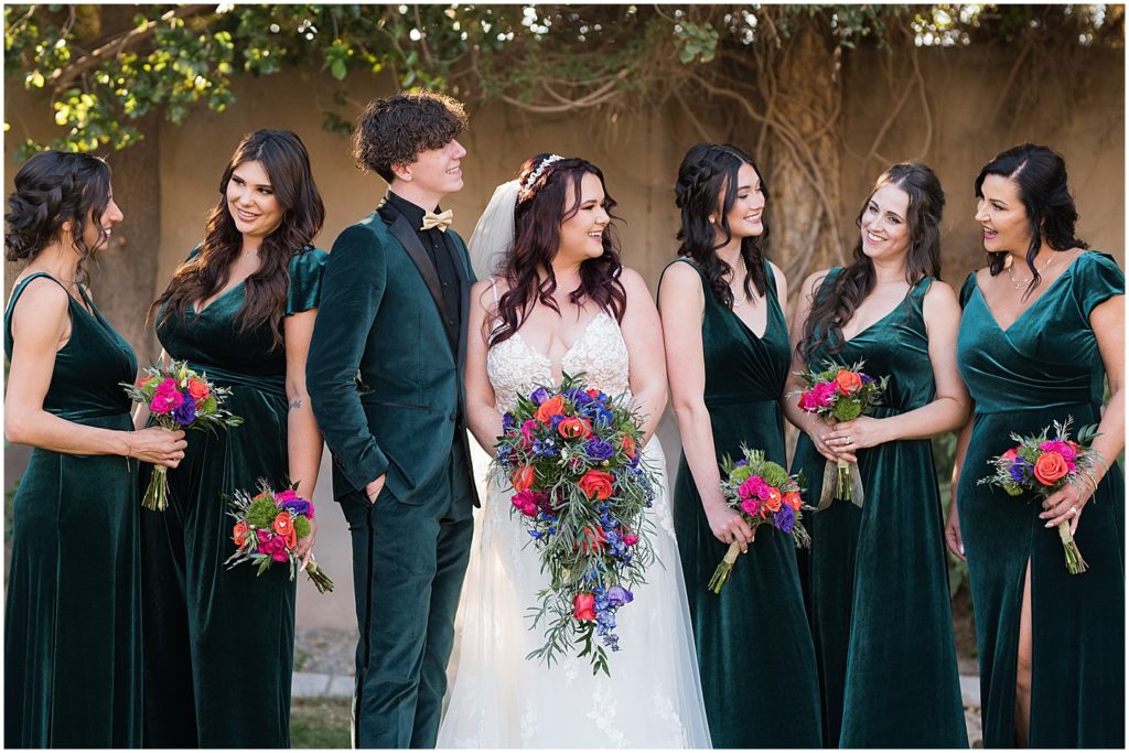 Bridal party looking at each other