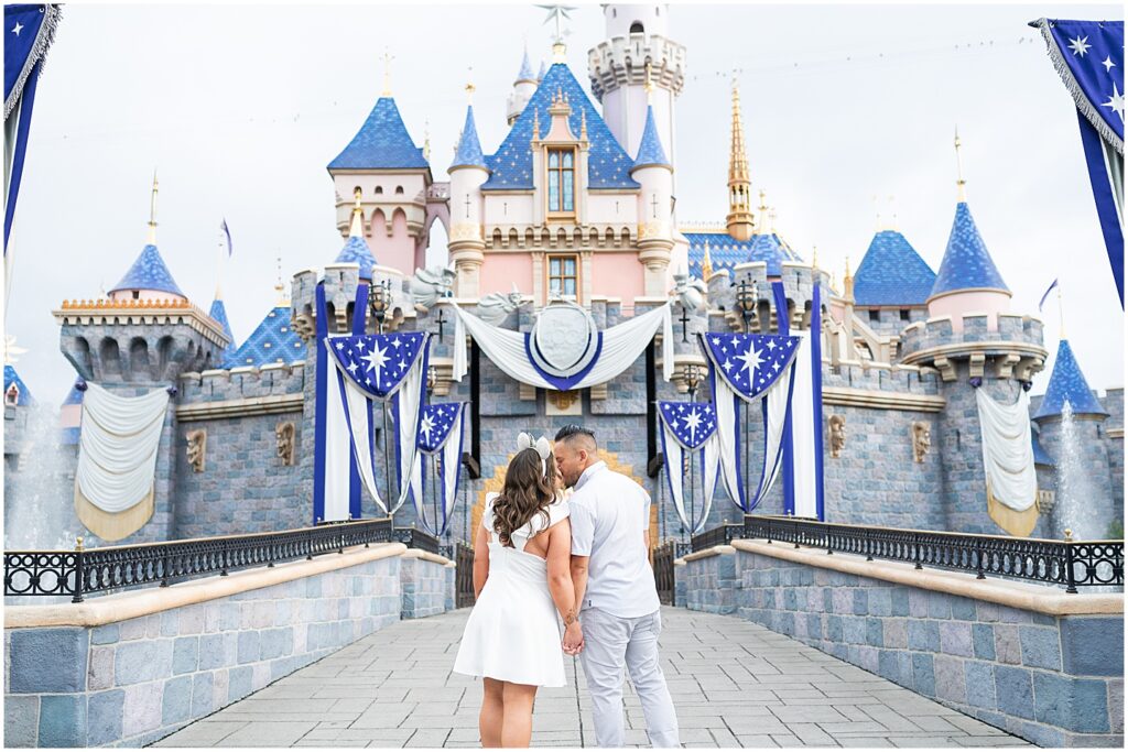 Disneyland engagement photos in front of the castle