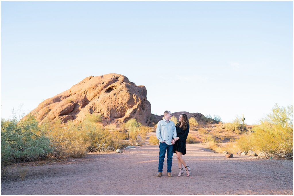 Papago Park engagement session in front of hole in the rock