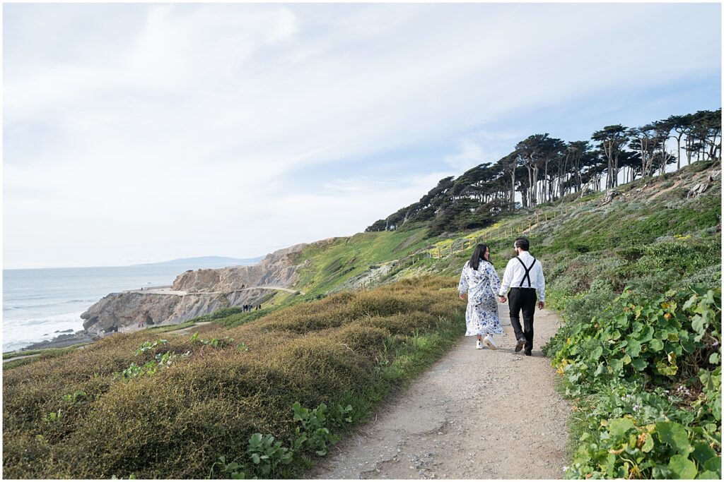 Walking down to the Sutro Baths for their engagement pictures